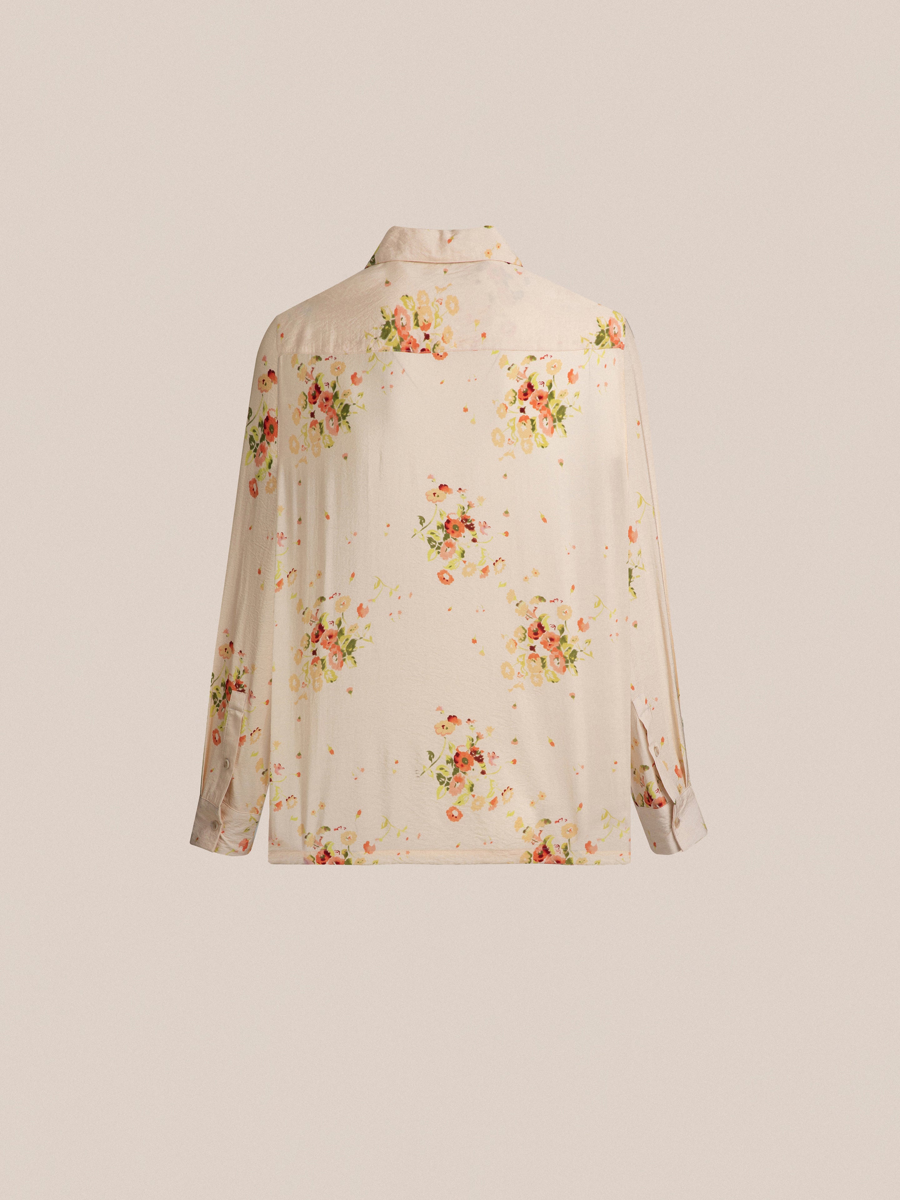 A Kanhati Garden Long Sleeve Camp Shirt with Phulkari motifs print on it.