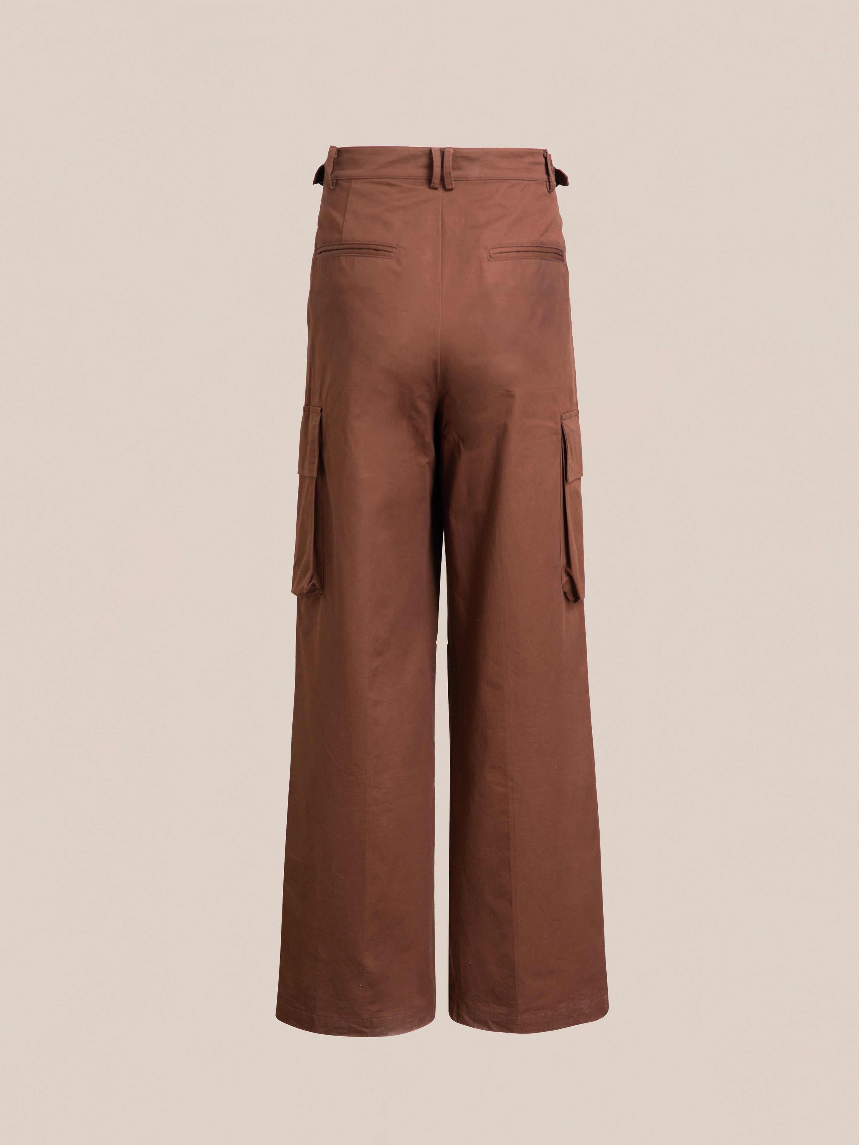 FOUND Pleated Pocket Trousers with side cargo pockets on both thighs, featuring a brown, wide-legged design, viewed from the back against a neutral background.