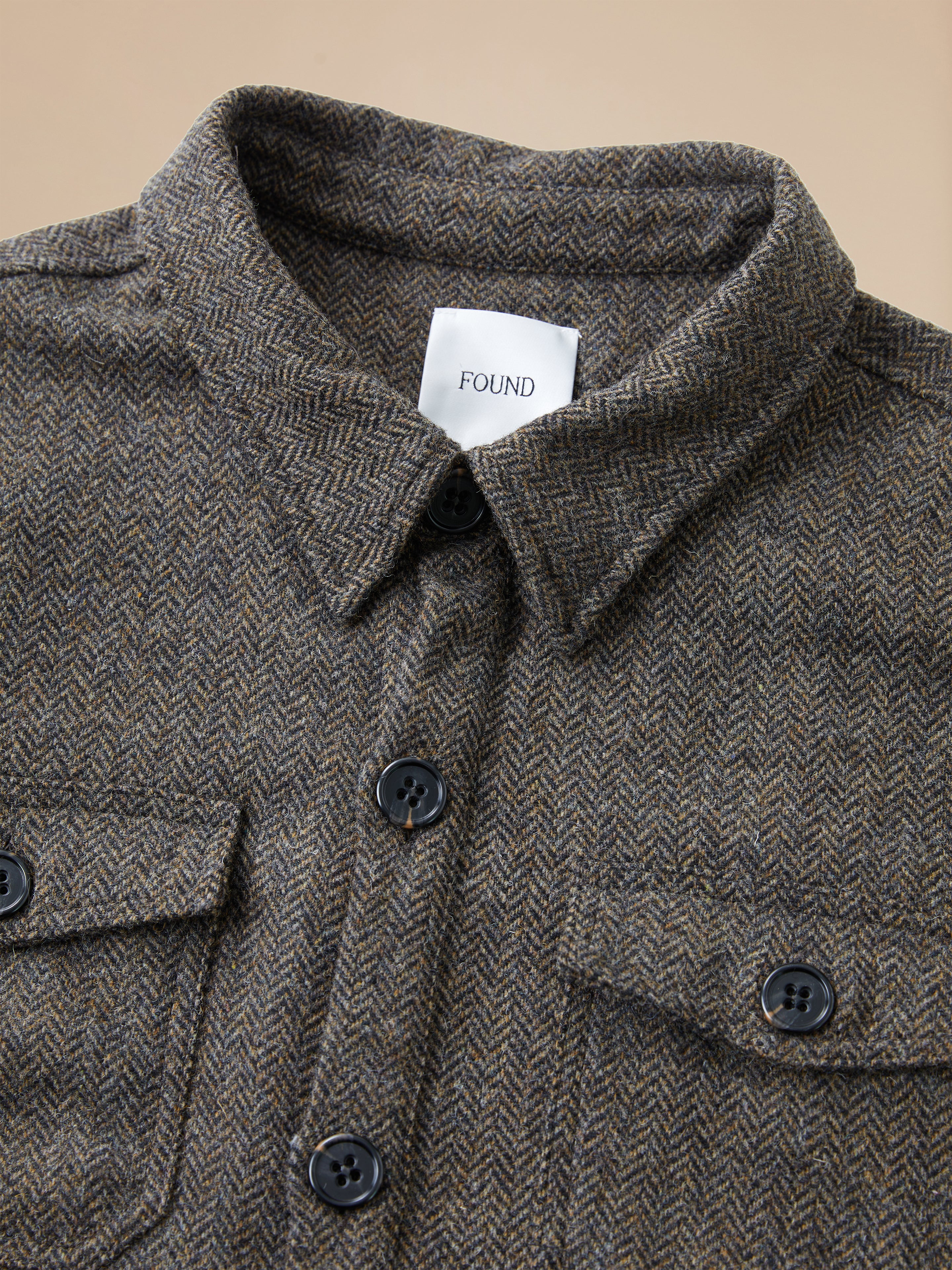 A close up of a Found Raven Herringbone Overshirt.