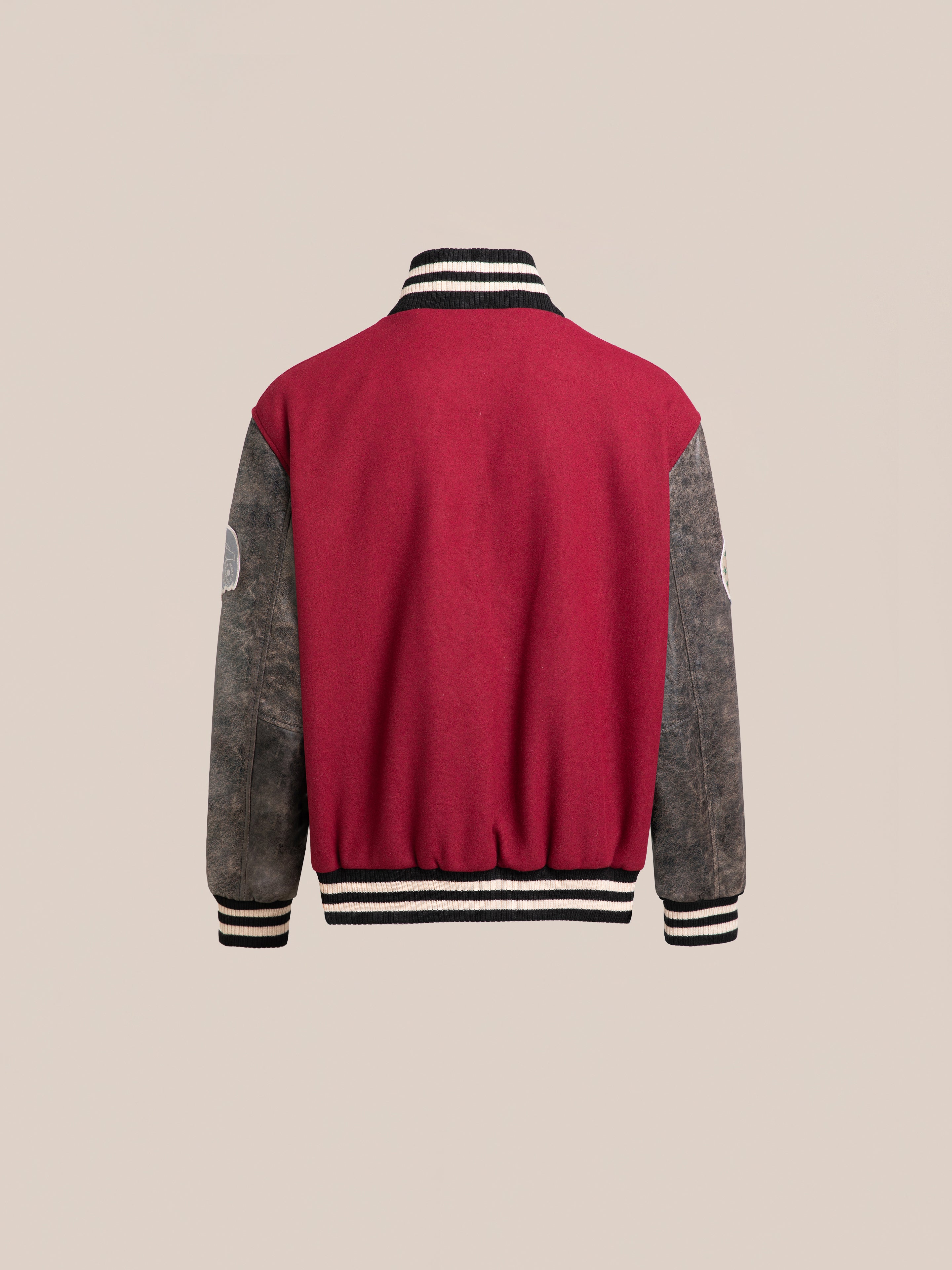 Back view of the Found Crimson Letterman Jacket, showcasing a vintage look with striped cuffs and collar, crafted from ethically sourced materials.