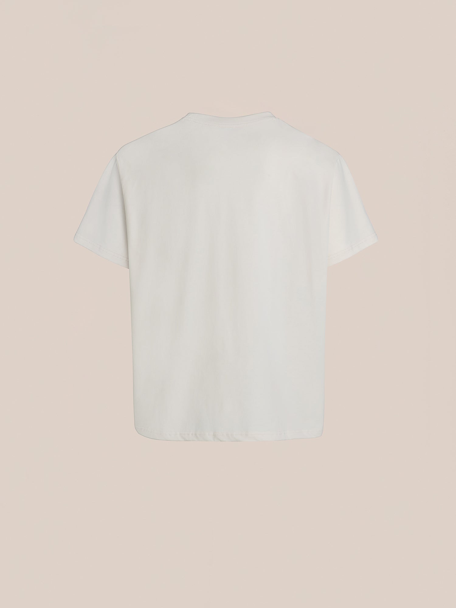 Back view of the Hand Art Graphic Tee by FOUND, crafted from soft cotton, set against a beige background.