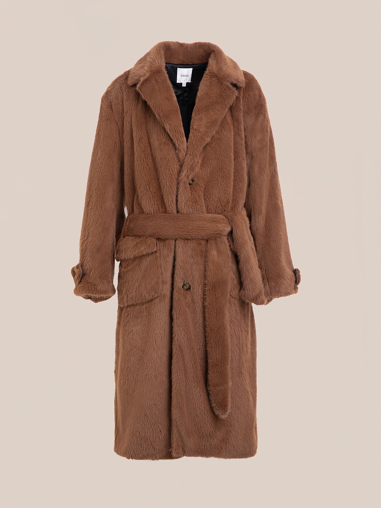 The Long Faux Fur Coat by FOUND boasts an oversized fit with a wide collar, double-breasted buttoned front, and a matching belt in brown faux fur.