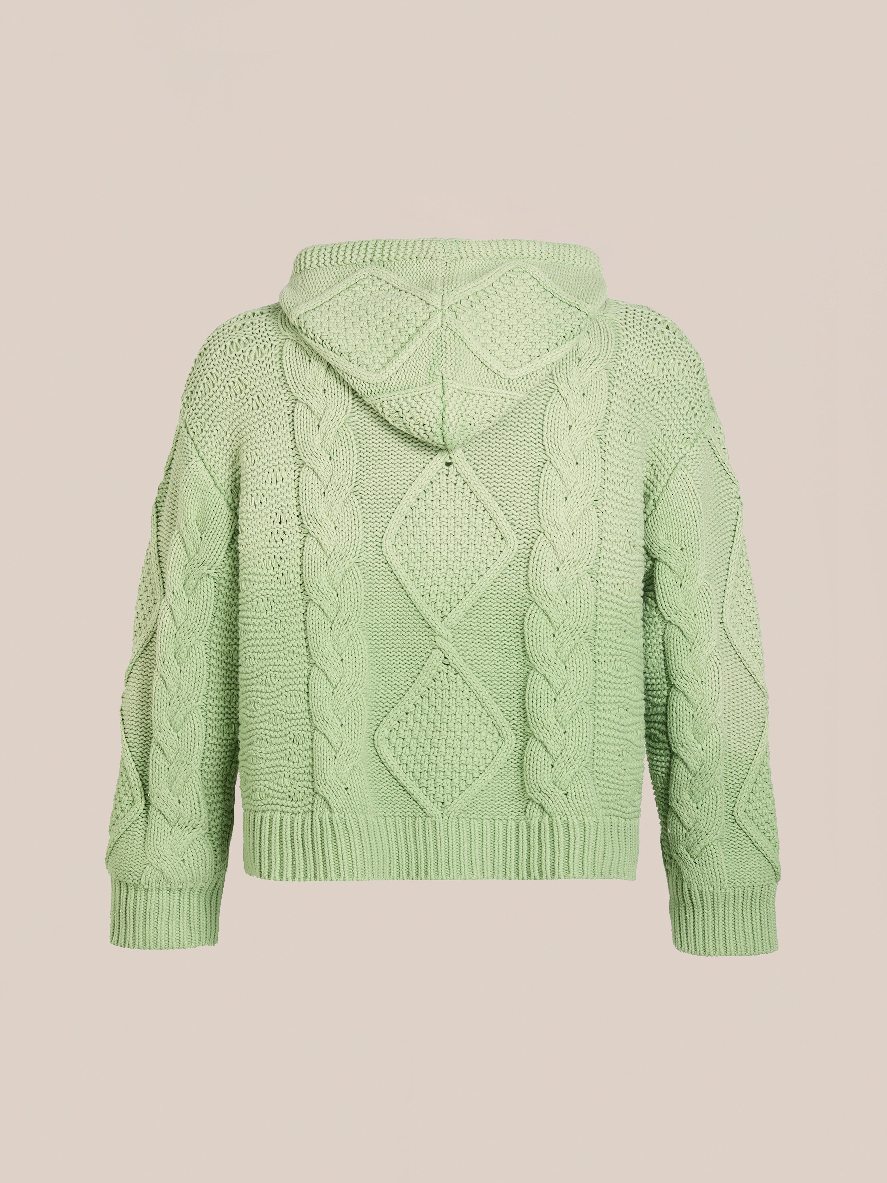 The Zip Up Cable Knit Hoodie by FOUND is a light green cotton blend with a relaxed unisex fit, featuring a zip-up design and hood. Displayed on a plain beige background, it’s ideal for cozy days.