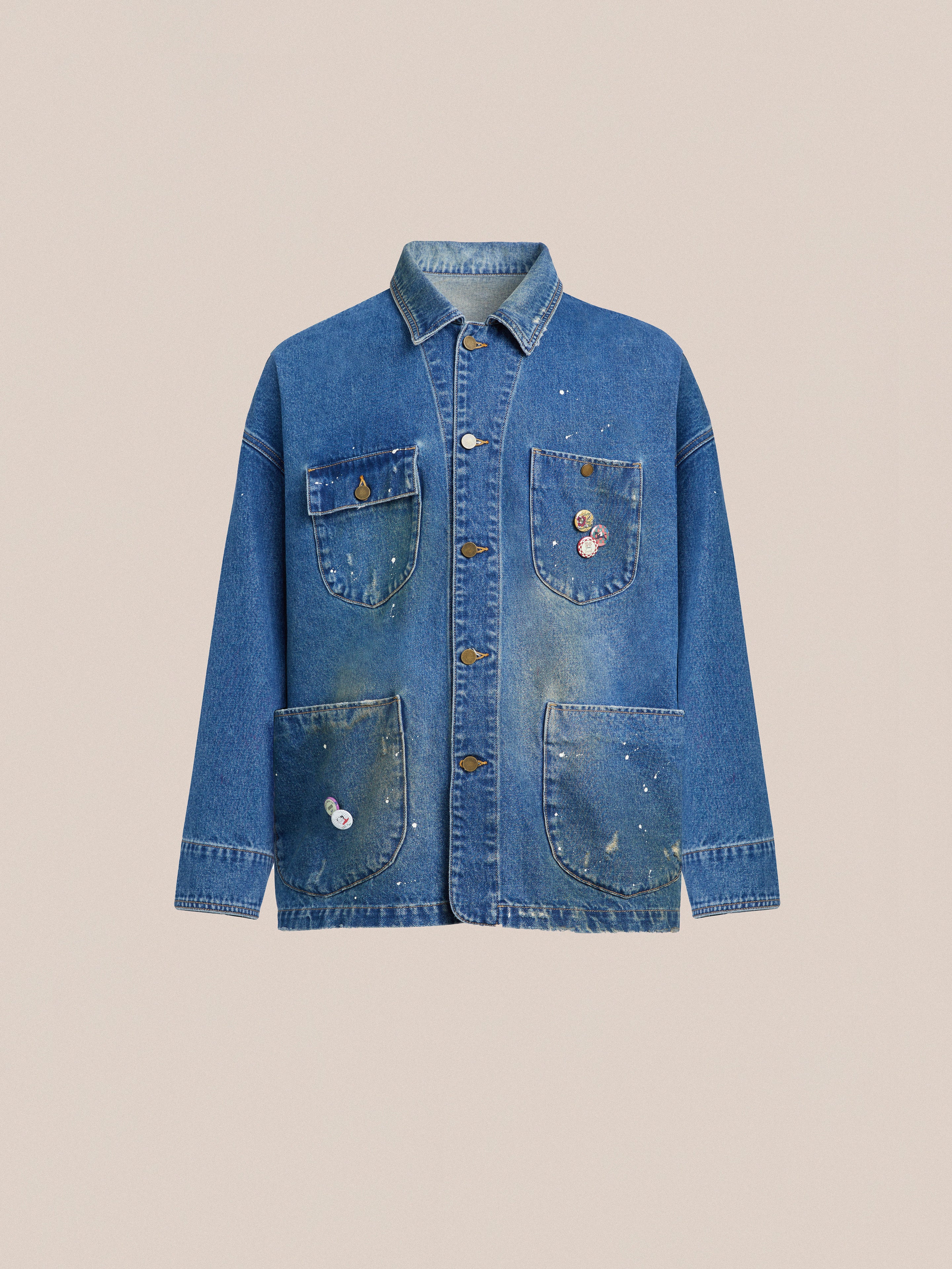 A blue Kavir denim painter jacket with patches on the sleeves and pockets by Found.