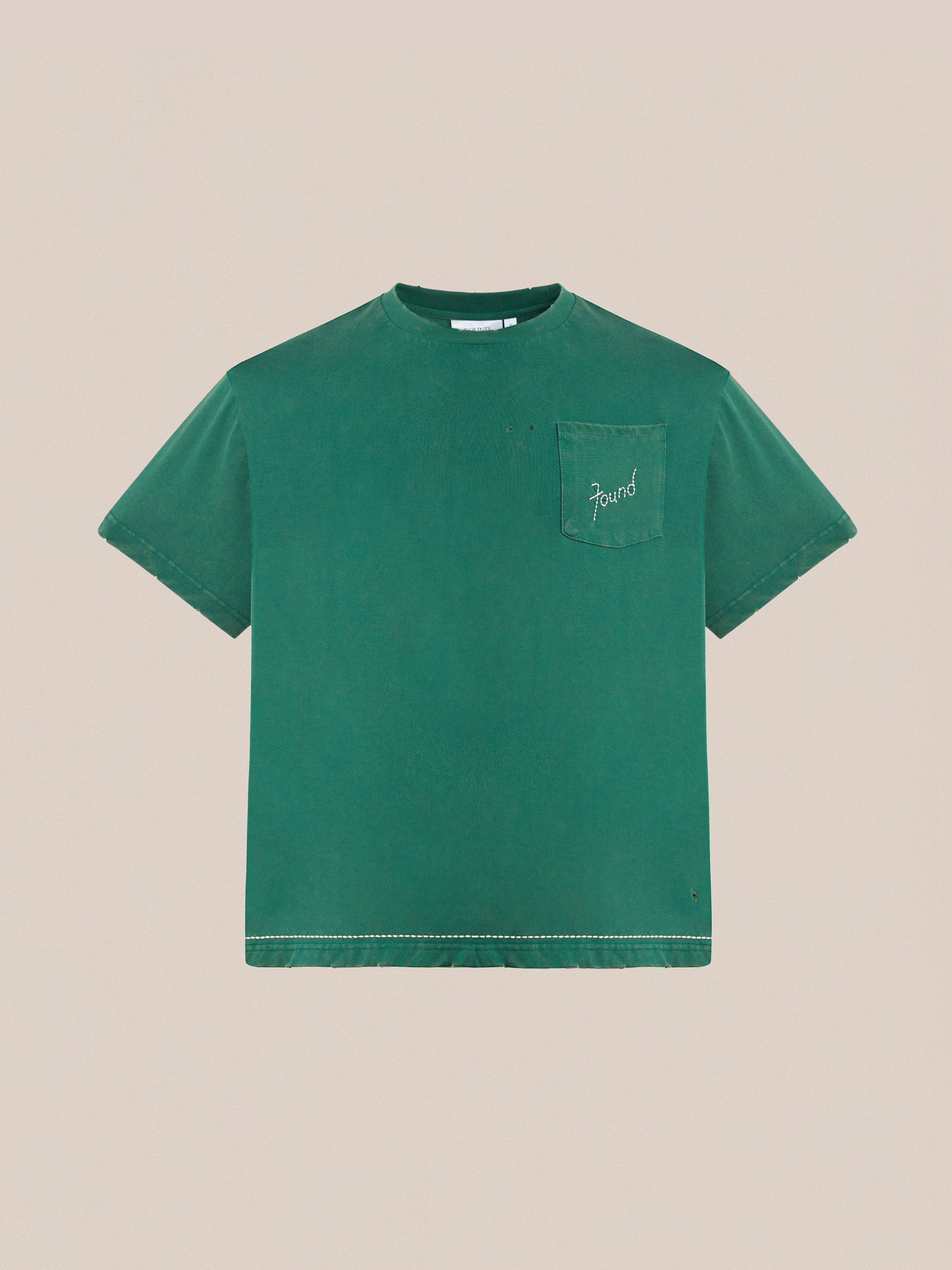 A green Embroidered Logo Tee by Found, featuring short sleeves and a small front pocket with the word "found" embroidered in cursive.