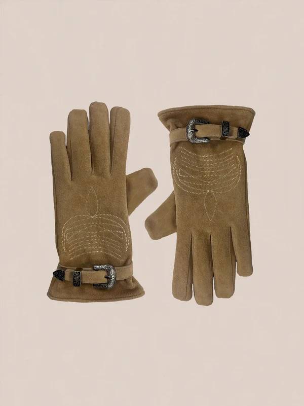 A pair of Suede Western Gloves by FOUND in brown suede with decorative stitching and adjustable wrist buckles is displayed on a neutral background.