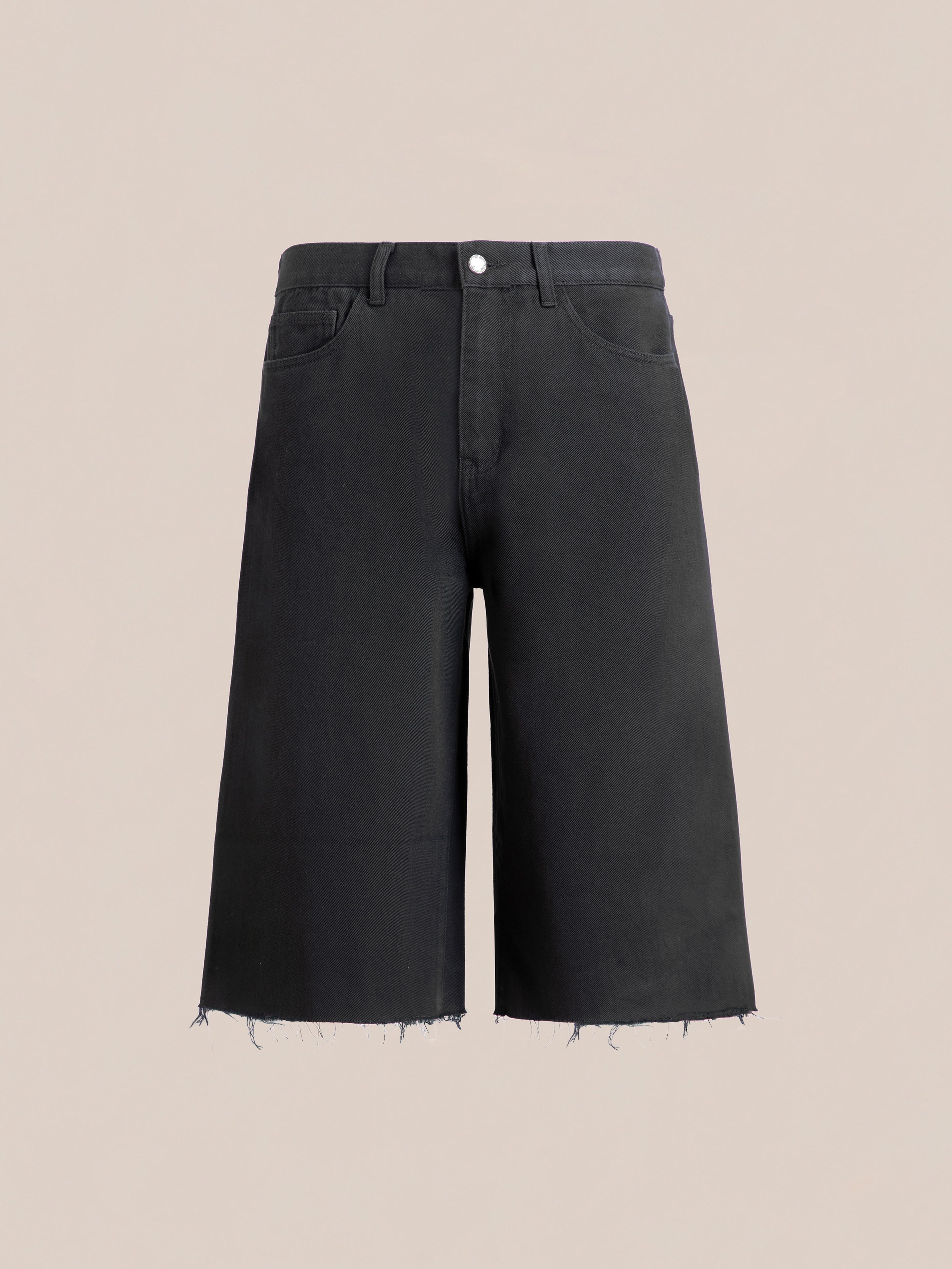 Lacy Jean Jorts by FOUND, featuring frayed hems, front pockets, and a button closure, set against a plain beige background.