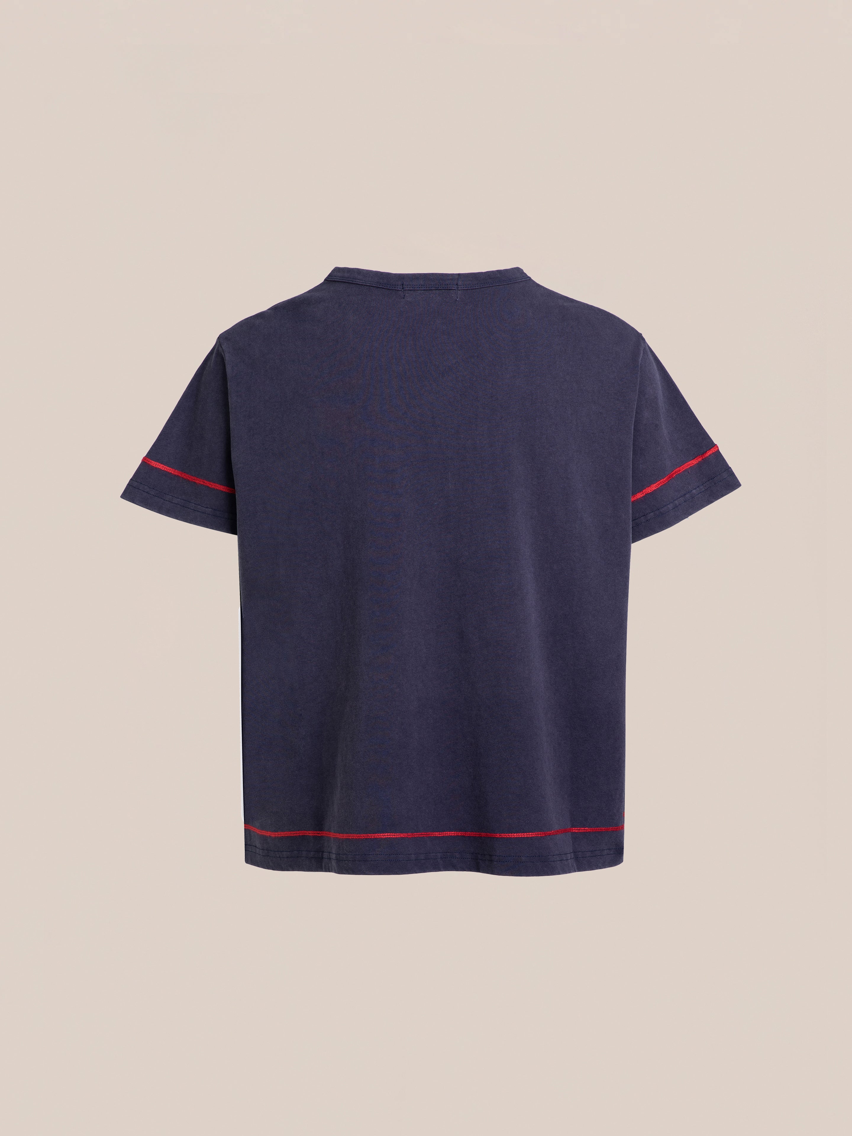 Back view of the short-sleeved Embroidered Henley by FOUND in navy blue, featuring red stitching on the sleeves and hem, against a beige background.