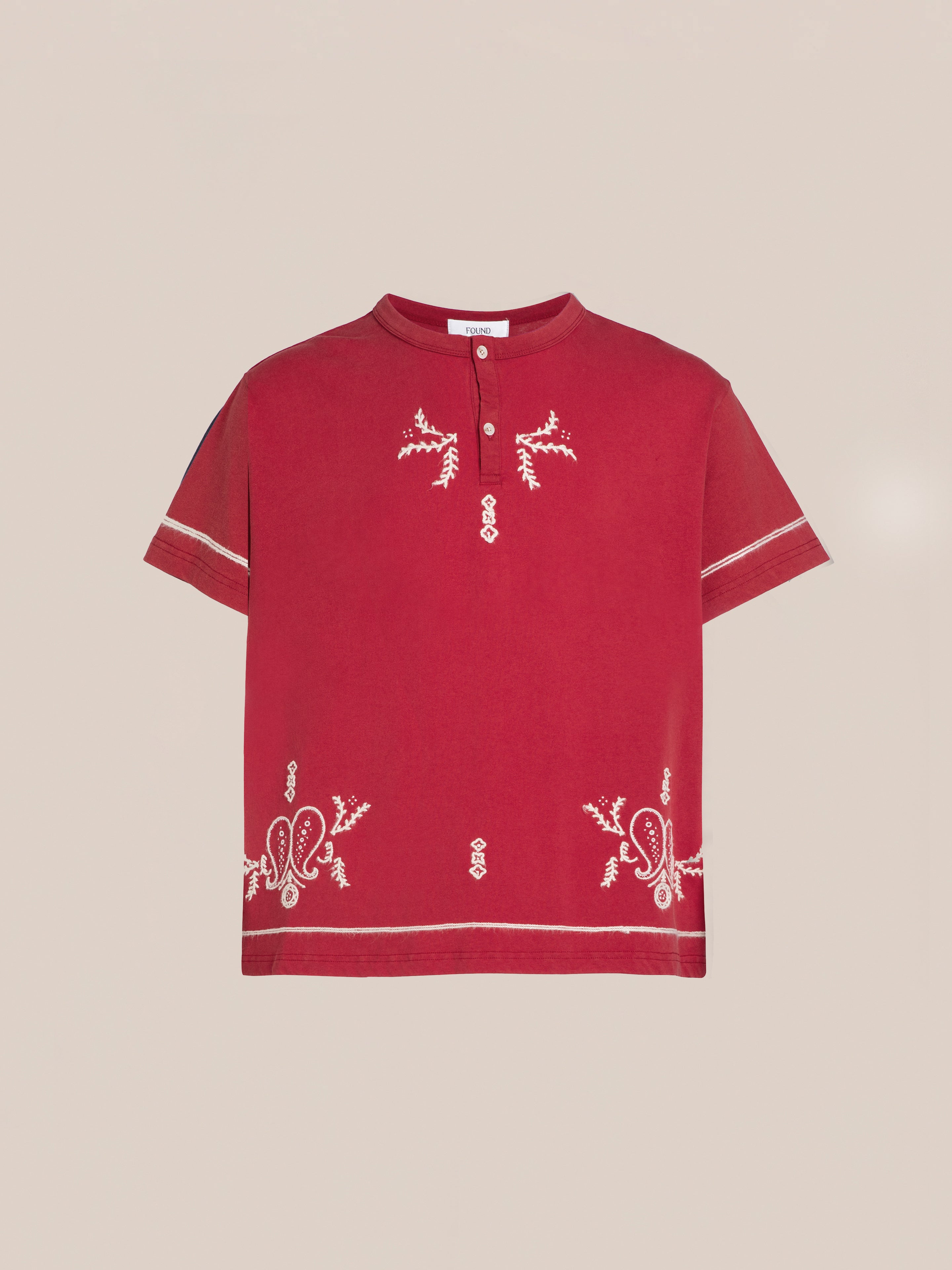 A red short-sleeve Embroidered Henley from FOUND, made from 100% cotton, featuring intricate kantha-style embroidery and a high collar with two buttons.