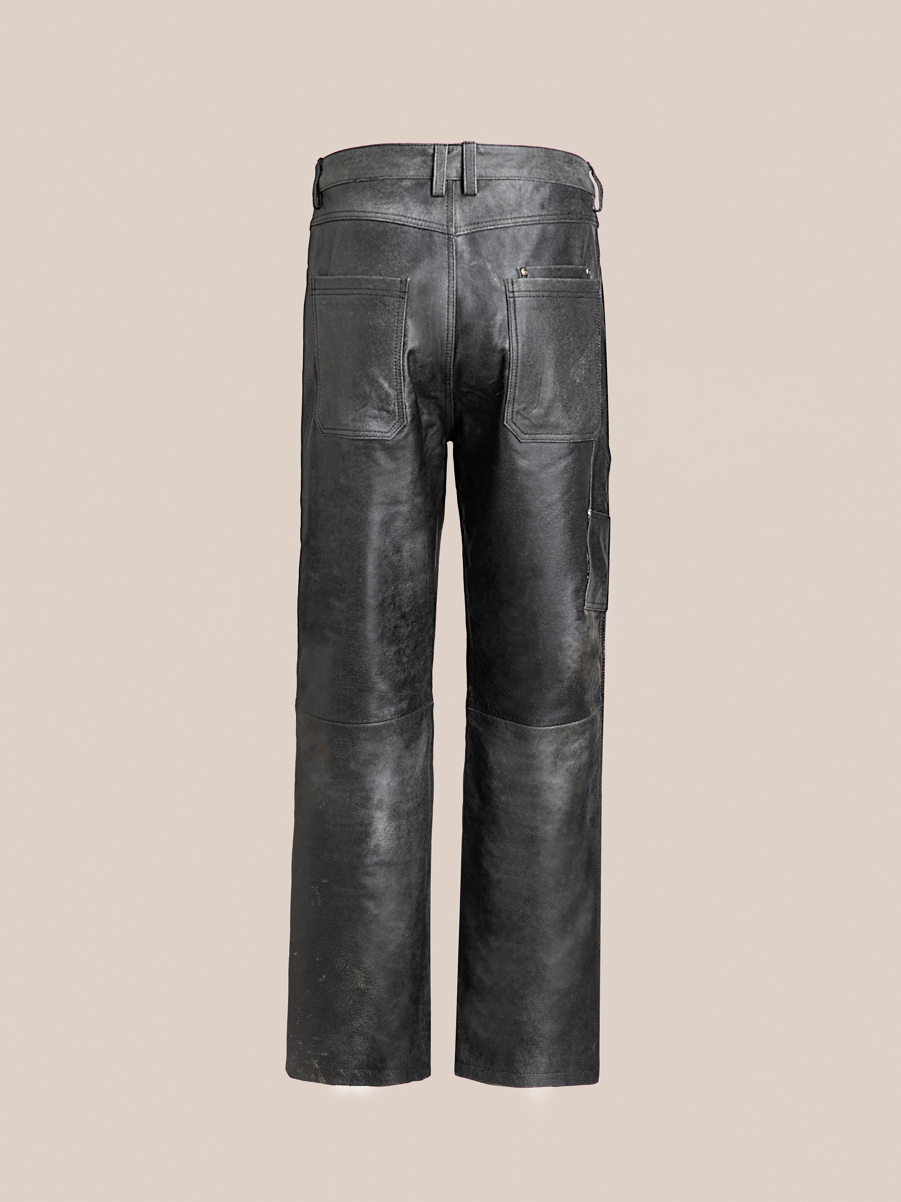 Back view of a pair of FOUND Distressed Genuine Leather Carpenter Pants with belt loops, pockets, and a slightly worn texture, set against a plain background.