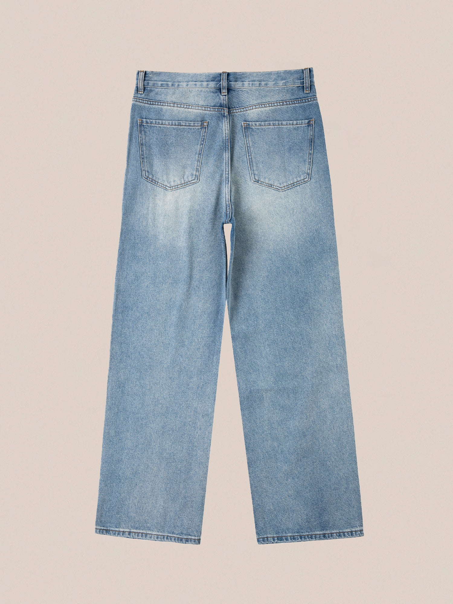 Back view of the Profound Mix Patch Jeans in light blue, crafted from structured denim cotton, featuring two back pockets on a plain background.