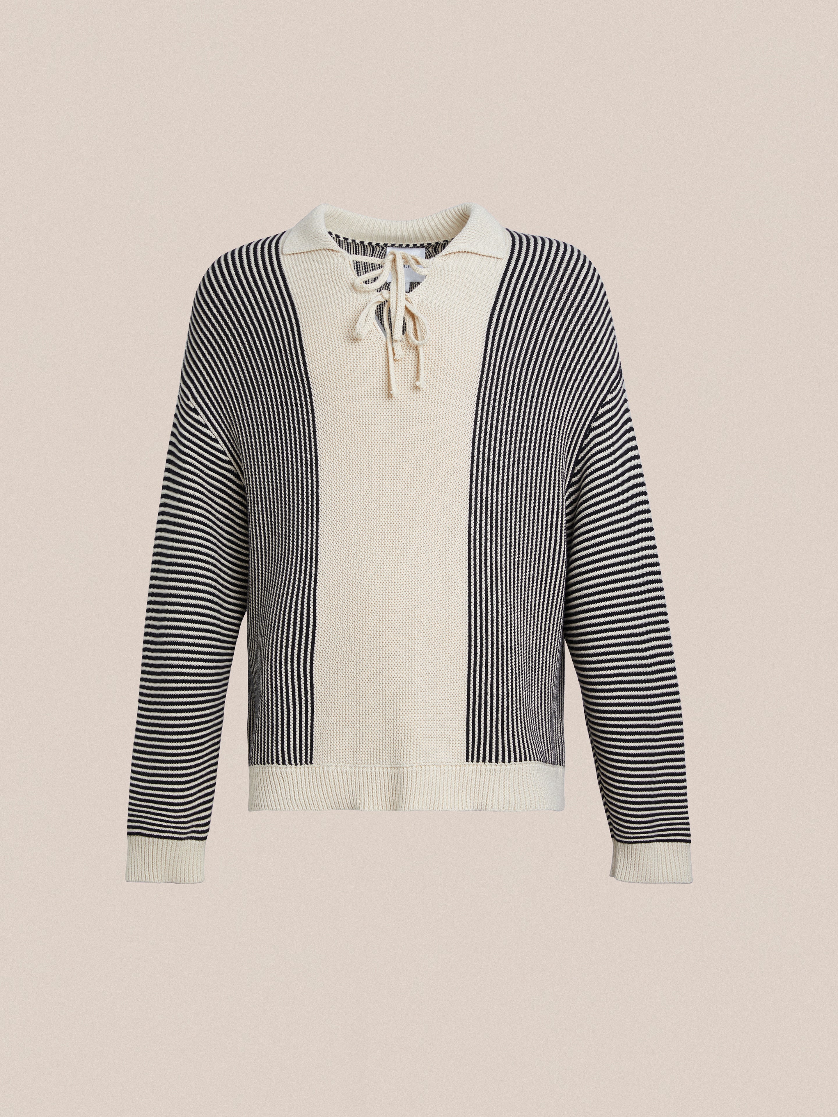 A white and black Found Tabas Tie Knit Collared Sweater with a striped pattern and intricate knit patterns.