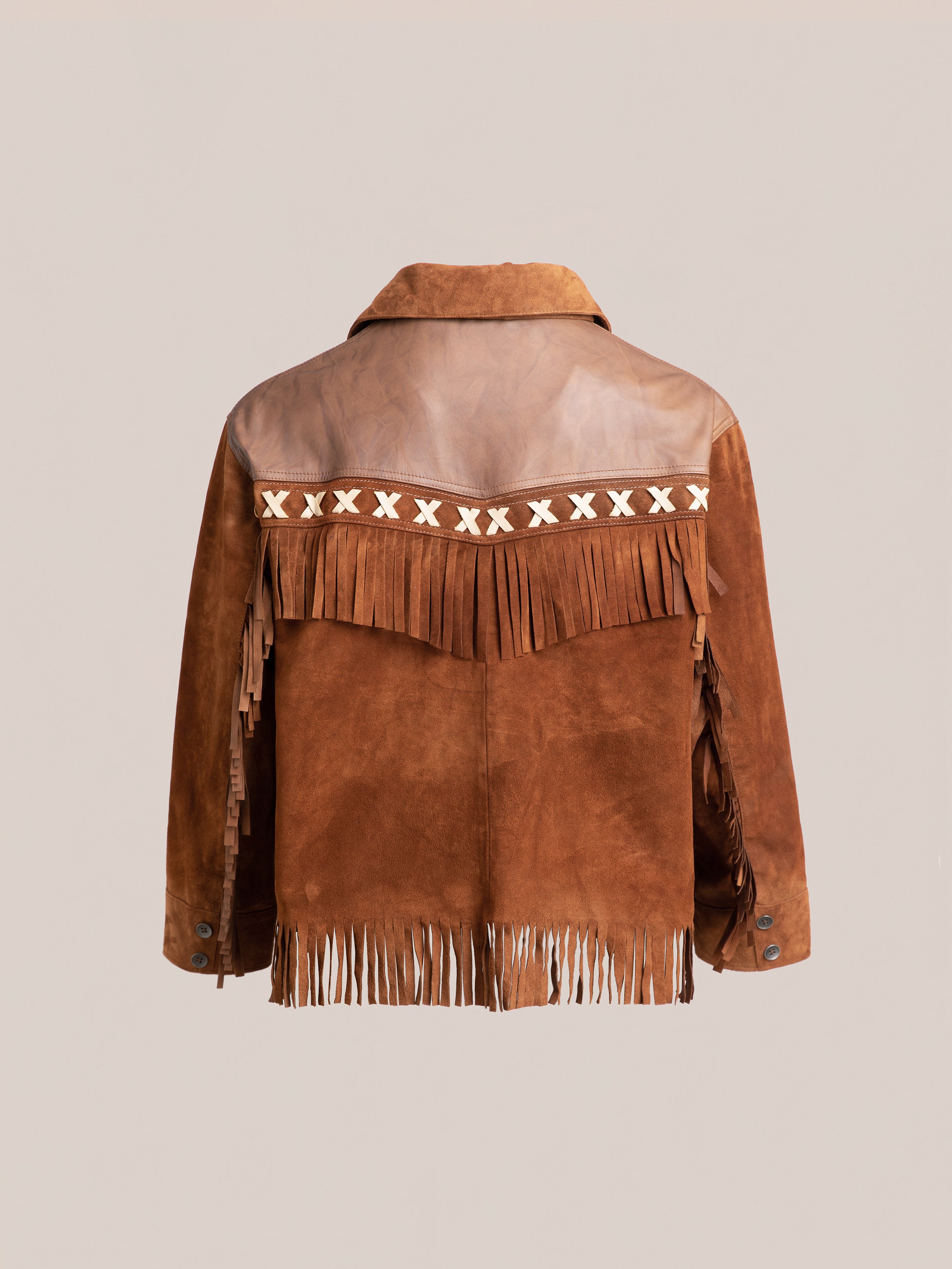 The Western Fringe Suede Leather Jacket by FOUND is crafted from ethically sourced materials, featuring a brown suede design, fringe accents, and a white X pattern on the upper back. This jacket exemplifies both style and sustainability when viewed from behind.